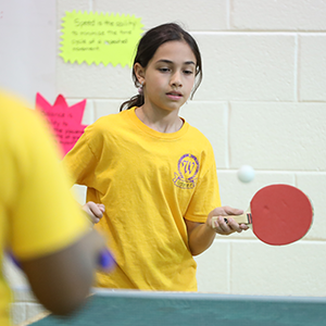 Girl playing ping pong