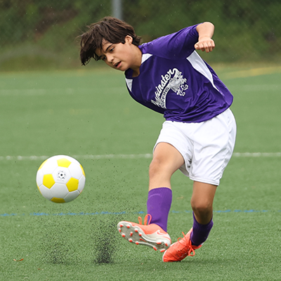 boy playing soccer
