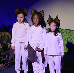 Kindergarteners perform Stella Luna on stage