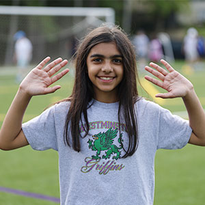 Waving at camera on sports day