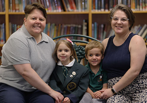 Family photo sitting on bench in library